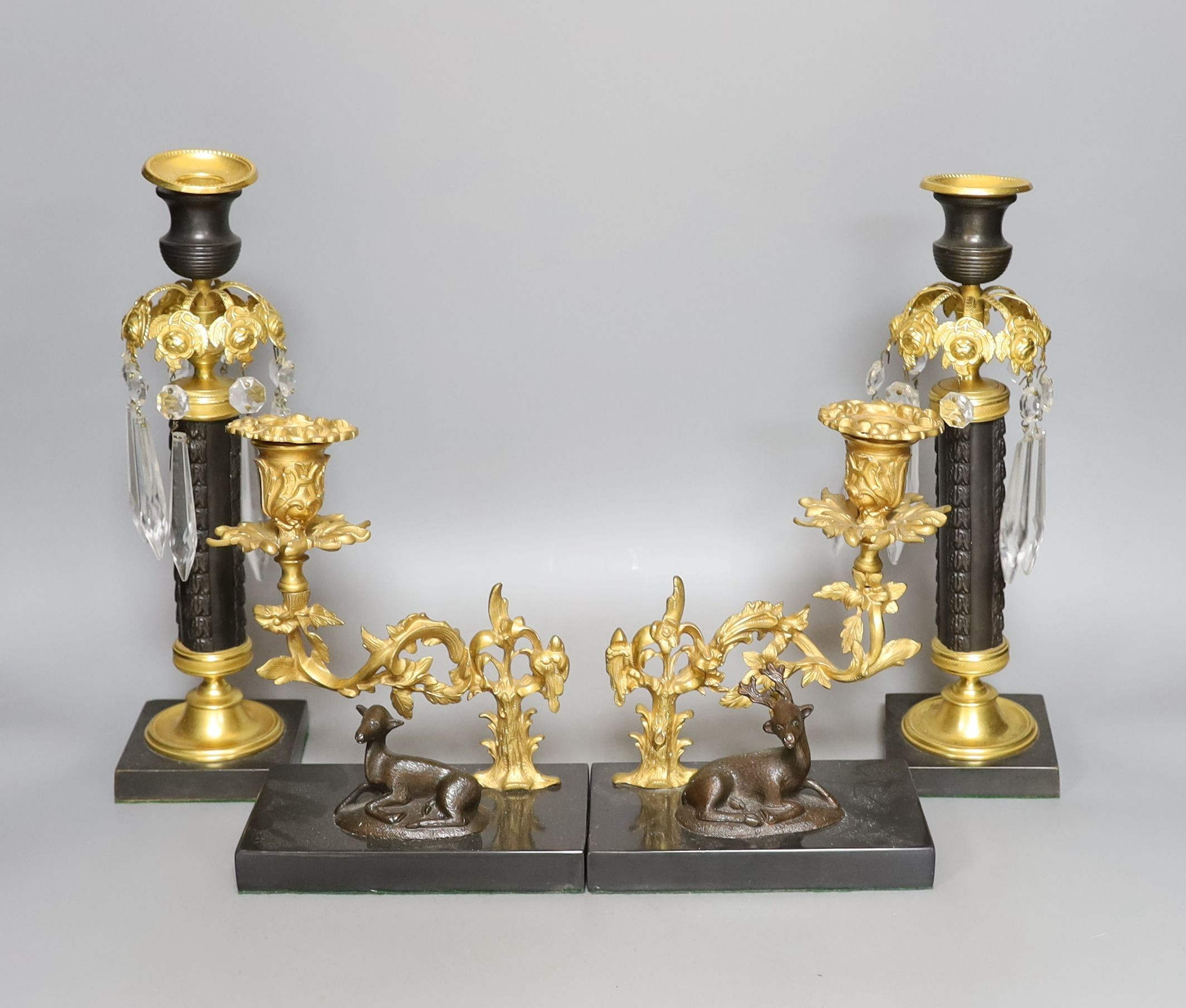 A pair of Empire-style bronze and brass table lustres, 29cm, and a pair of similar candlesticks